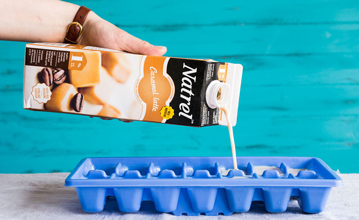 Pooring Caramel Latte milk in ice cubes tray